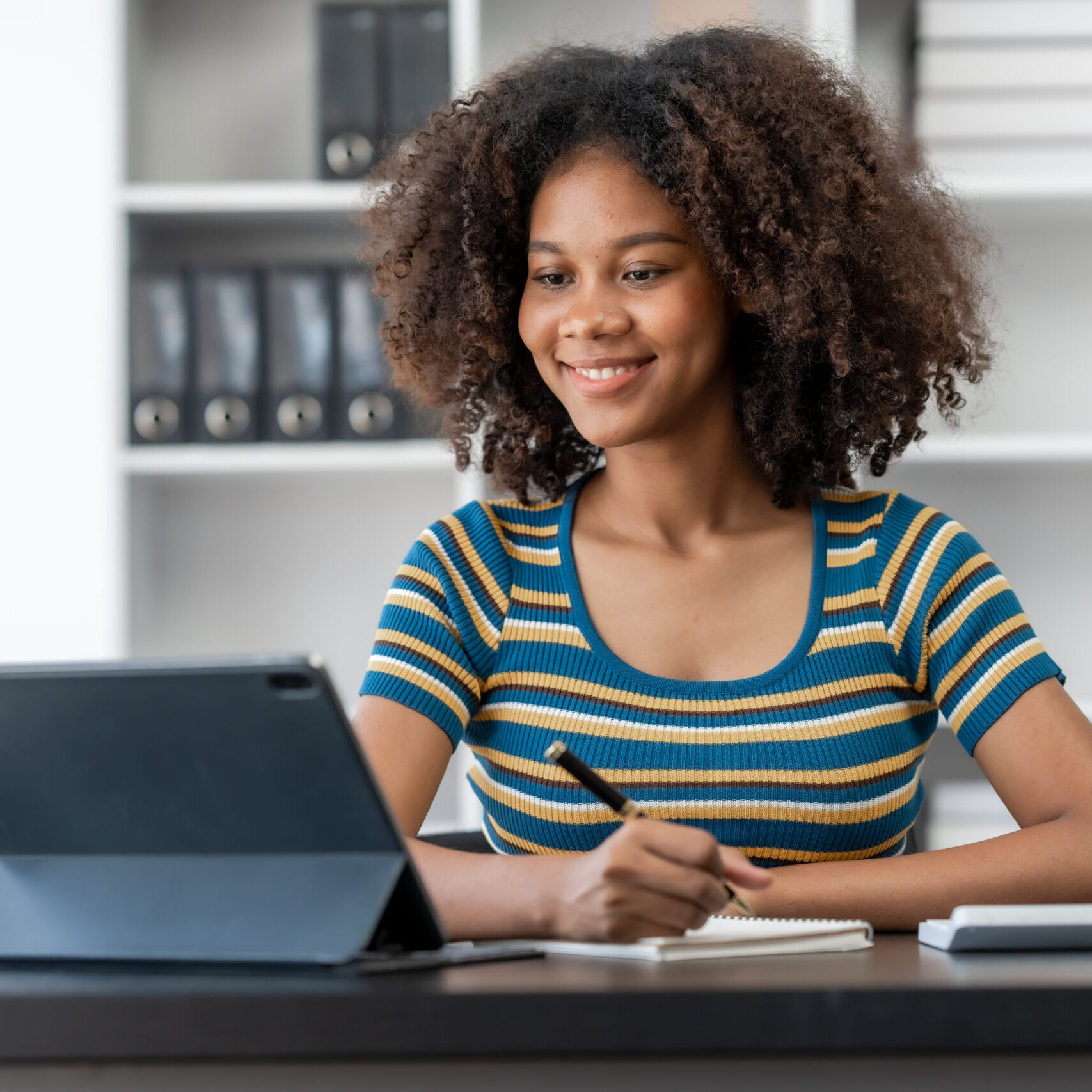 Young female african american student learning chinese language class online lecture via video conference, distance education